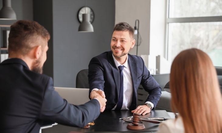 Shaking hands with recruitment partners for successful client acquisition